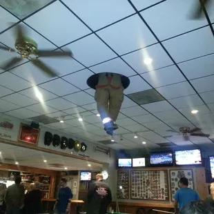 Fireman legs hanging out of the ceiling