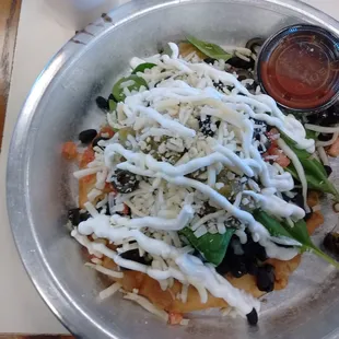 With bison, green chili, black beans &amp; bison. Finished off with sour cream!