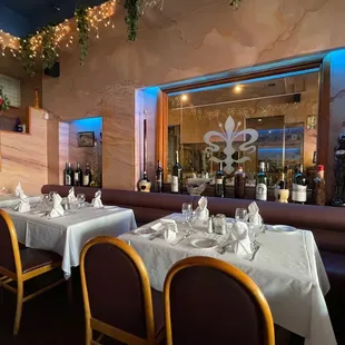 a dining room with tables and chairs