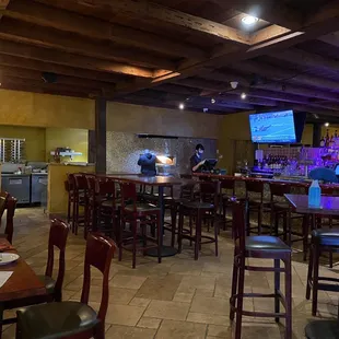 a restaurant with tables and chairs