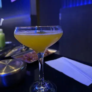 a cocktail in a coupe glass