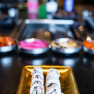 a plate of sushi rolls