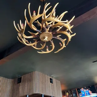 a large antler chandelier hanging from the ceiling