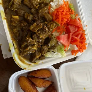 Curried Goat with white rice and salad with an added side of 4 Piece Fried Plantains