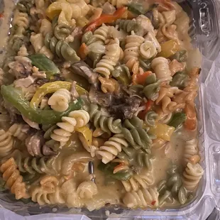 a pasta dish in a plastic container