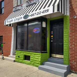 The outside of Fireside Cuisine with a new awning.