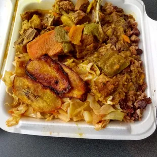 Small goat curry with cabbage, plantains, and rice and peas ($11.50). PLENTY of food for me but you can get large for a little more.