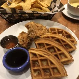 Chicken n waffles- chips n queso in background