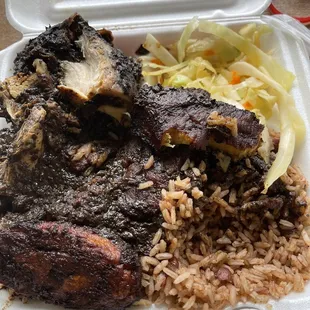 Jerk chicken with sauce, plantains, cabbage and rice. Jerk Chicken Jerk Chicken Jerk Chicken Jerk Chicken Jerk Chicken