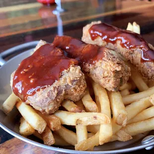 a plate of chicken and french fries