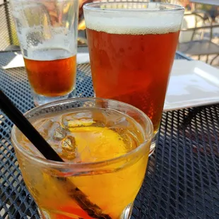 two glasses of beer on a table