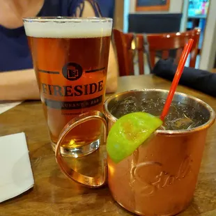 a copper mug with a lime garnish in it