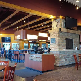 the inside of a restaurant with tables and chairs