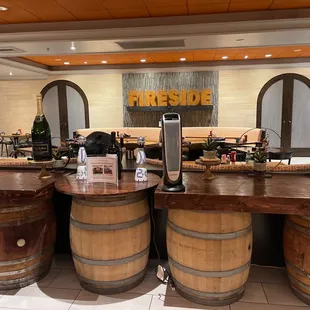a bar with wine barrels