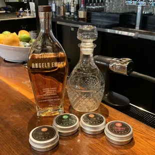 a bottle of whiskey, salt and pepper shakers