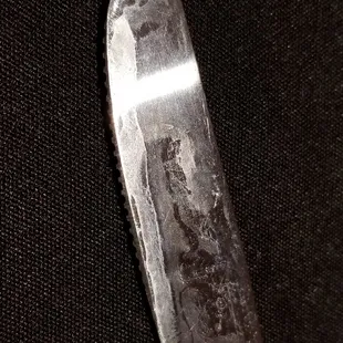 The other side of their &quot;clean&quot; butter knife. Totally unacceptable and very disappointing.