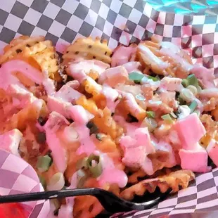 Waffle fries that was drench in their cheese &amp; other sauces