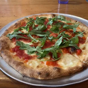 Pizza with peppers and arugula