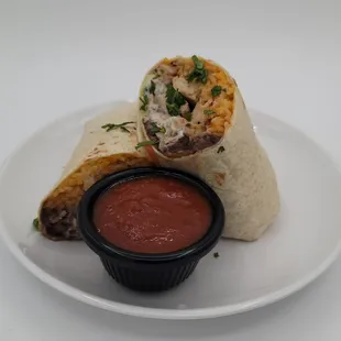 a burrito with salsa