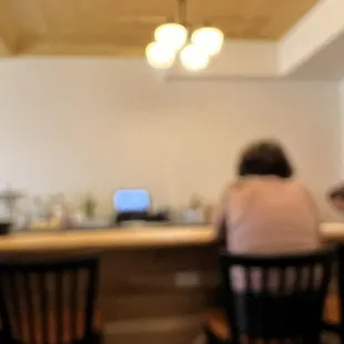 two people sitting at a bar