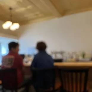 people sitting at a bar