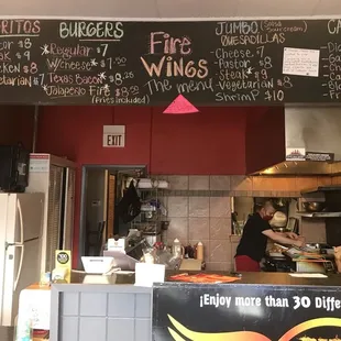 a menu on the wall of a restaurant