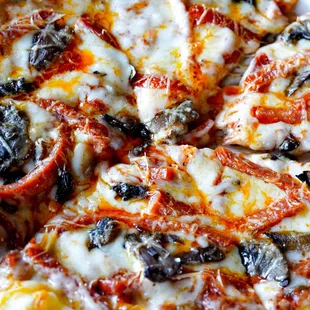 Crispy pizzas made in hickory wood-fired oven with house-made marinara and dough.