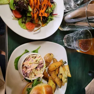 Chicken burger, fingerlings, cole slaw, and salad.