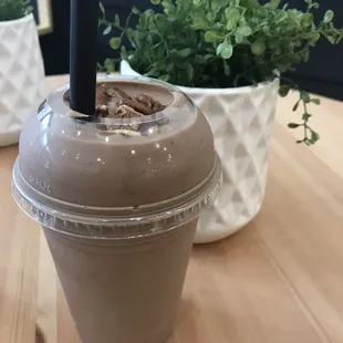 a smoothie in a plastic cup