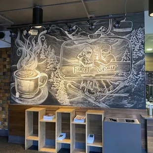 a coffee shop with a chalkboard wall
