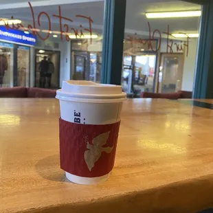 a cup of coffee on a table