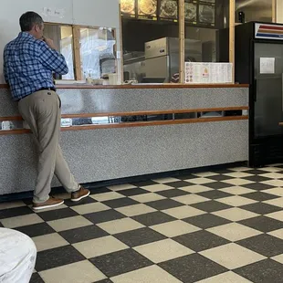 a man sitting at the counter