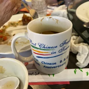 a cup of tea and a spoon