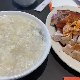 a bowl of soup and a plate of meat