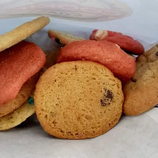 a variety of cookies in a paper bag