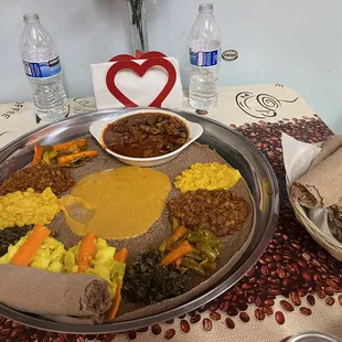 Injera with 2 veggie combos and awaze tibs