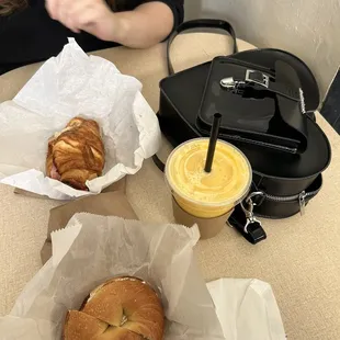 ham and cheese croissant, mango smoothie, plain bagel