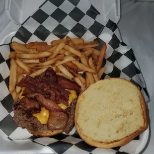 Bacon Cheese Burger with fries. Cooked perfect crunchy bacon and perfect temperature