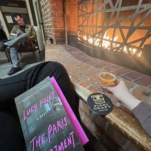 Fireplace with a beer and a book