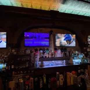 a baseball game being played on tvs