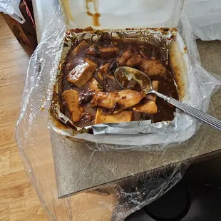 Fish with Bean curd in Garlic Sauce (partially eaten dish)