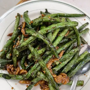 Green beans stir fried. It&apos;s on menu under vegetables but it has pork fyi for the vegetarians