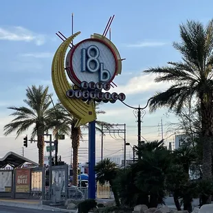 a sign for a restaurant on the side of the road