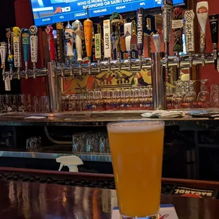 a glass of beer on the bar