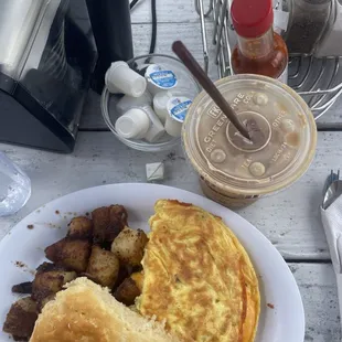 Cheddar omelette with home fries and biscuit