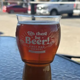 a glass of beer on a table