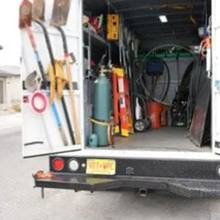 A picture of tools in the back of a work