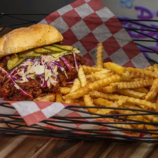 a basket with a sandwich and french fries