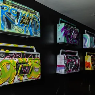 a wall of cassette recorders on display