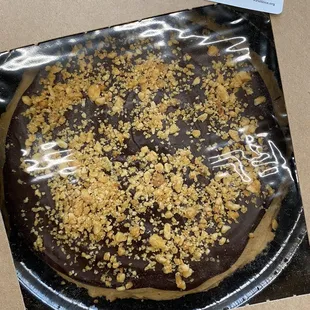 a chocolate cake covered in crumbs